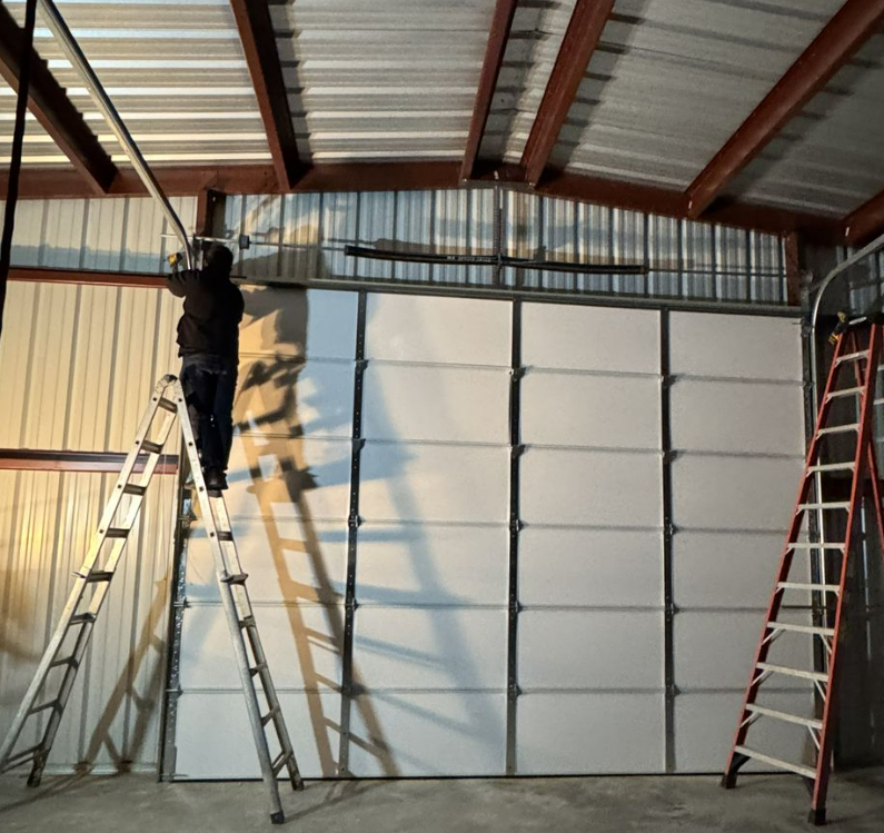 Technician performing local garage door repair in Sun City Center, Florida, ensuring smooth operation and reliable service