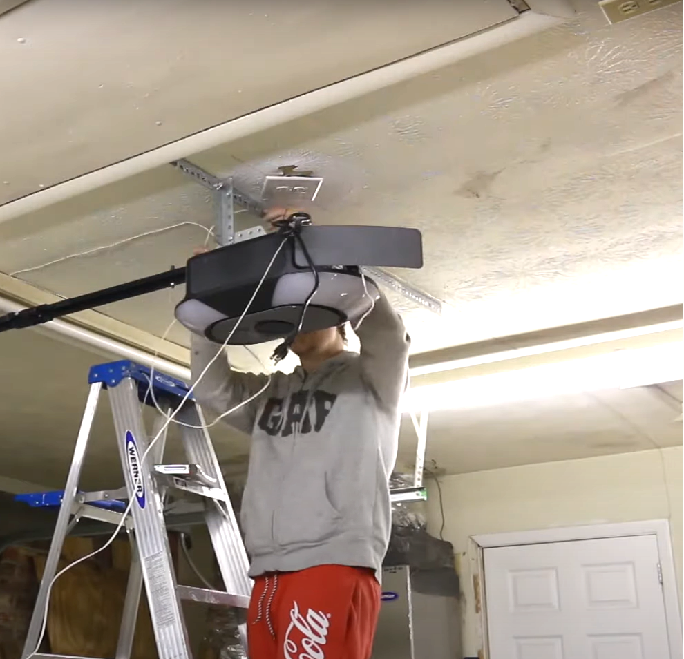 Technician performing garage door opener installation in Sun City Center, Florida