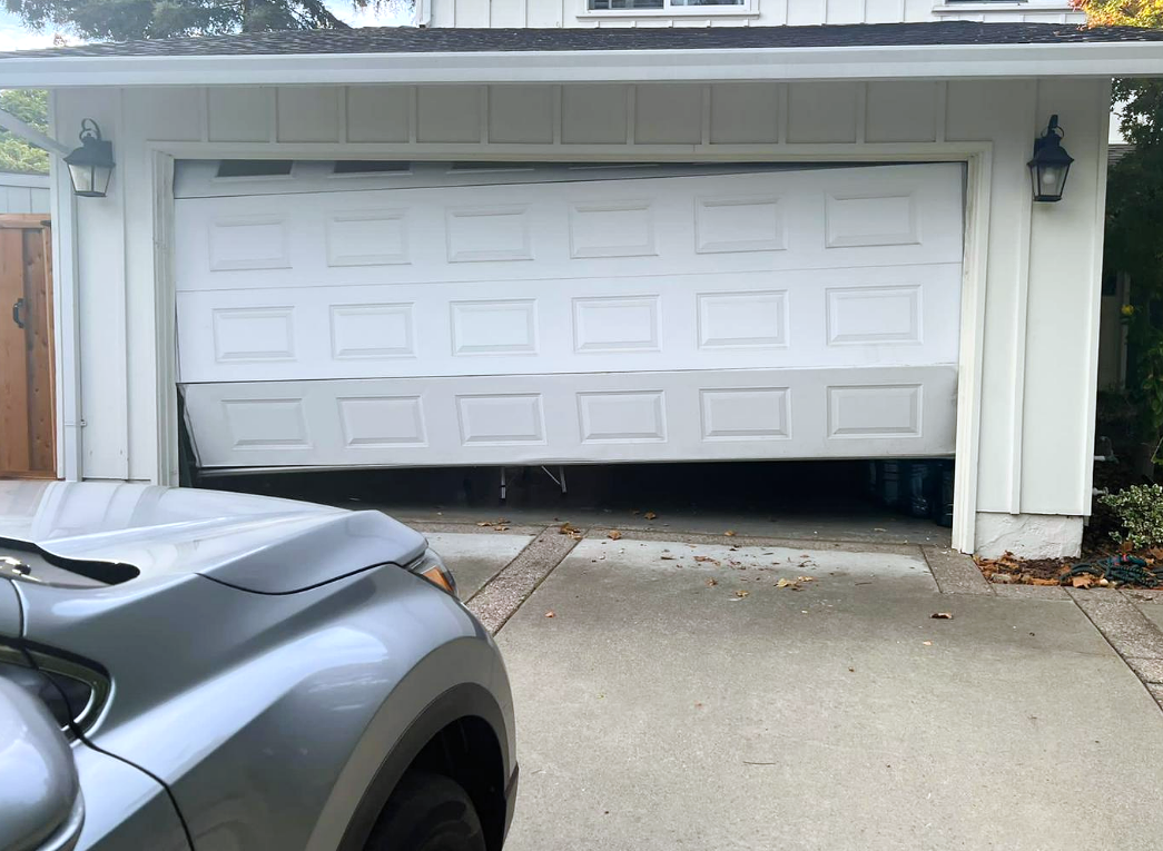 Technician repairing a local garage door in Sun City Center, Florida, ensuring smooth operation and durability.