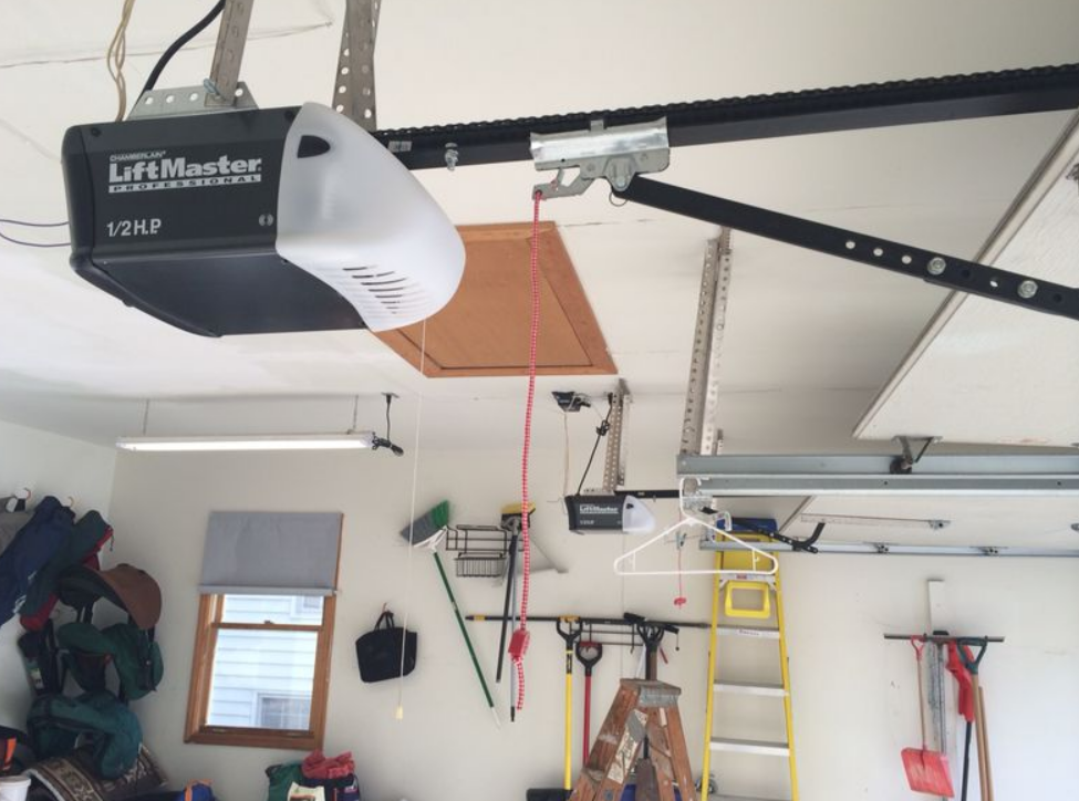 Technician performing garage door opener installation in Sun City Center, Florida