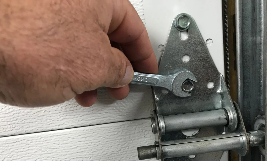 Garage door technician fixing a noisy garage door in Sun City Center, Florida